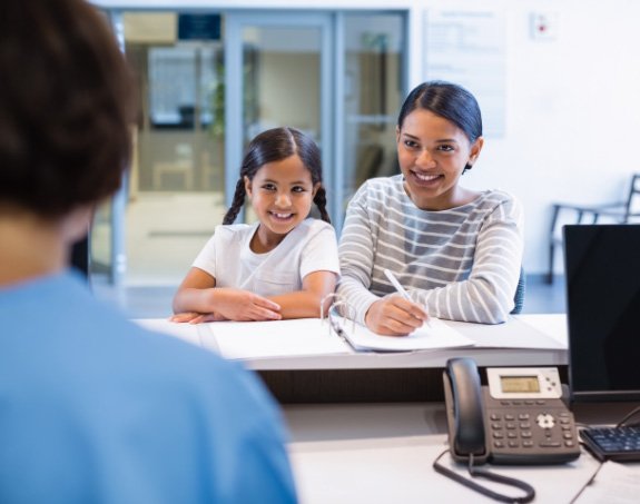 patient looking at her smile in the mirror